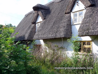 Old thatched roof duplex cottage on The Green